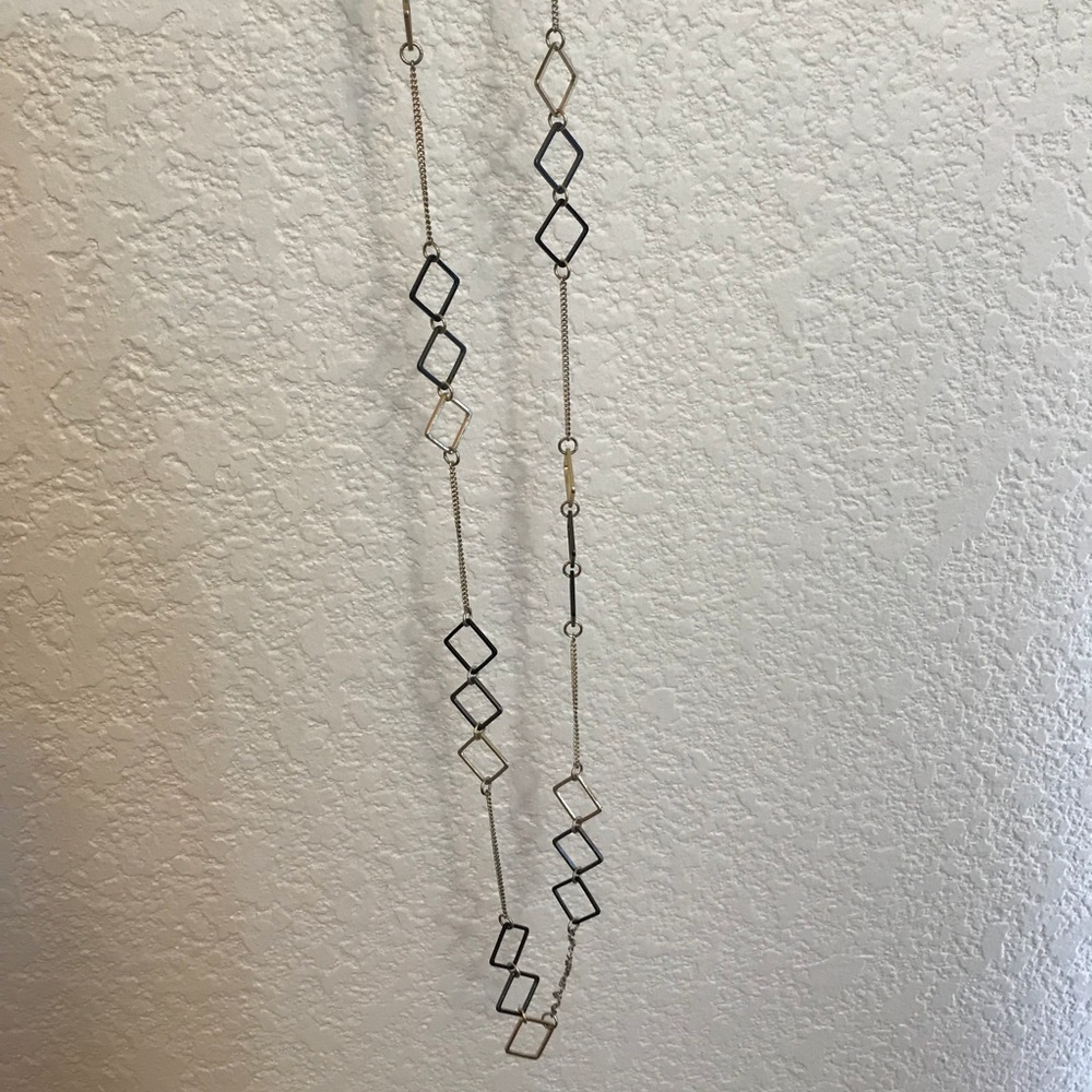 Long black and gold necklace